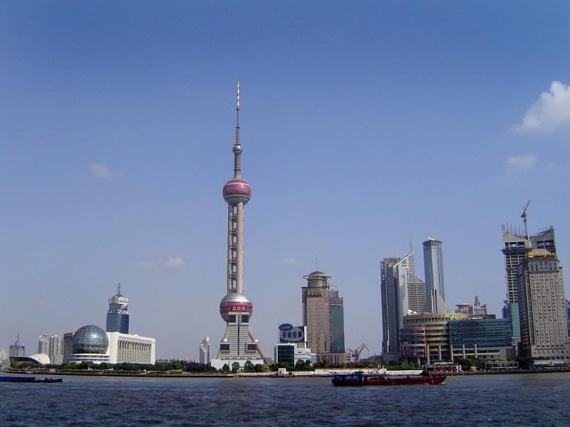 Free Stock Photo: View of Shanghai City Skyline from Huangpu River Featuring Oriental Pearl Tower Against Sunny Blue Sky